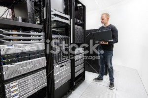 stock-photo-37569050-it-technician-monitors-data-center