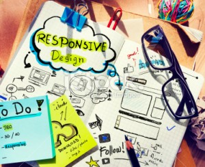 stock-photo-40881036-designer-s-desk-with-responsive-design-concept